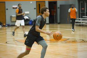 Student playing intramural basketball